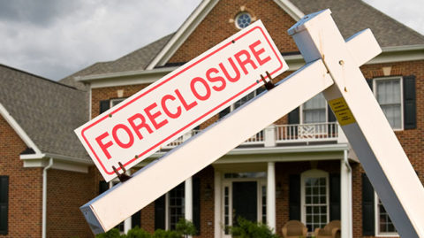 House with a foreclosure sign image