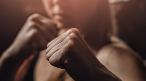 Woman with raised fists