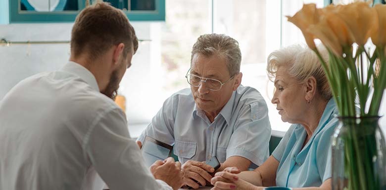 Older couple talking to estate planner