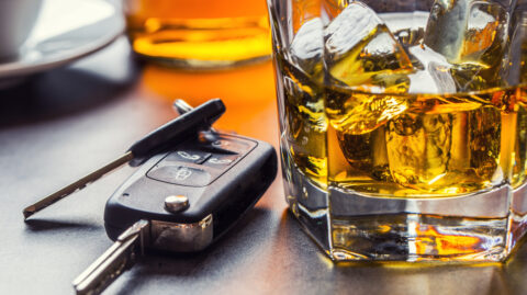 A Pennsylvania driver's keys sit next to his drink before he gets arrested for Driving Under the Influence.